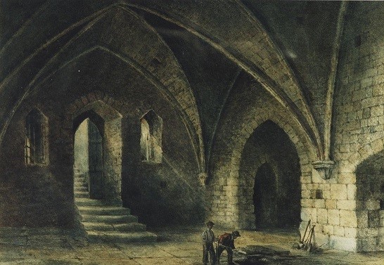 Interior of a historic stone building featuring arched ceilings, with two figures working on the floor, surrounded by stairs and large doorways.